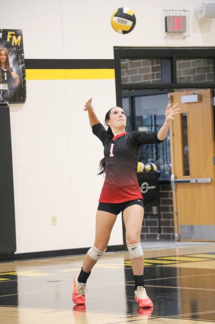 Essex’s Kinley Robinette serves in the Trojanette’s opening round loss to East Mills at the Corner Conference Volleyball Tournament. (Joel Stevens/ The Red Oak Express)