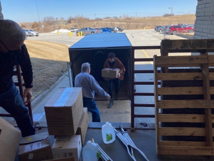 Left: Russ Cooner and MCMH employee Laura Kloewer help unload the medical supplies at MCMH Friday, March 11.