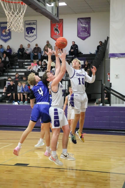 Stanton’s Evan Gettler (#10) battles for a rebound in the Vikings’ win over Griswold. The senior guard scored 13 points in the win, then followed that up with 25 points in Friday’s win over Fremont-Mills. (Joel Stevens/ The Red Oak Express.)